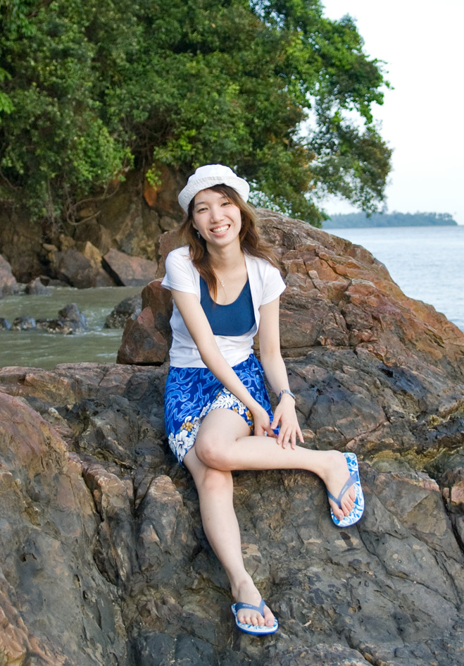 naomi Tham at Pasir pandek: Smiling on rock